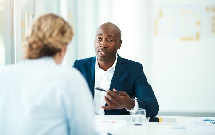 Interview in modern looking office.